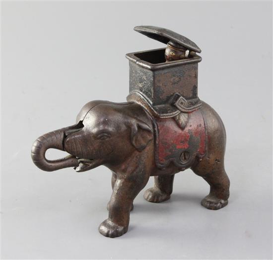 An American painted cast iron elephant and howdah money bank, 6.5in.